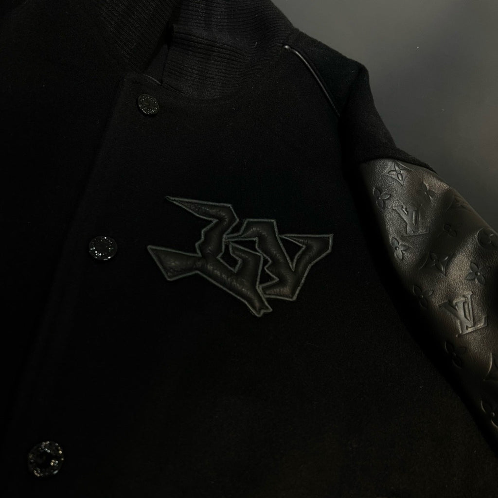 Blouson embossé monogram en cuir et laine