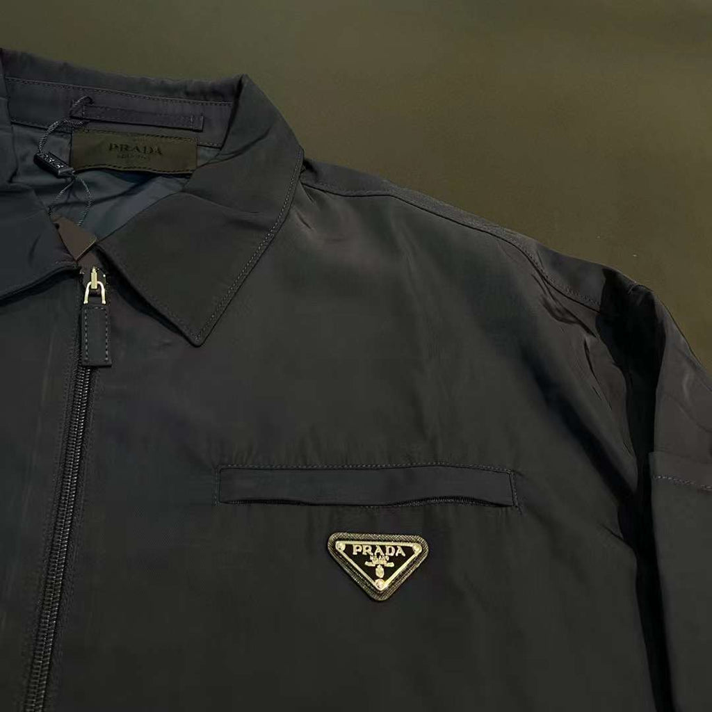 Prada veste zippée à plaque logo Bleu marine