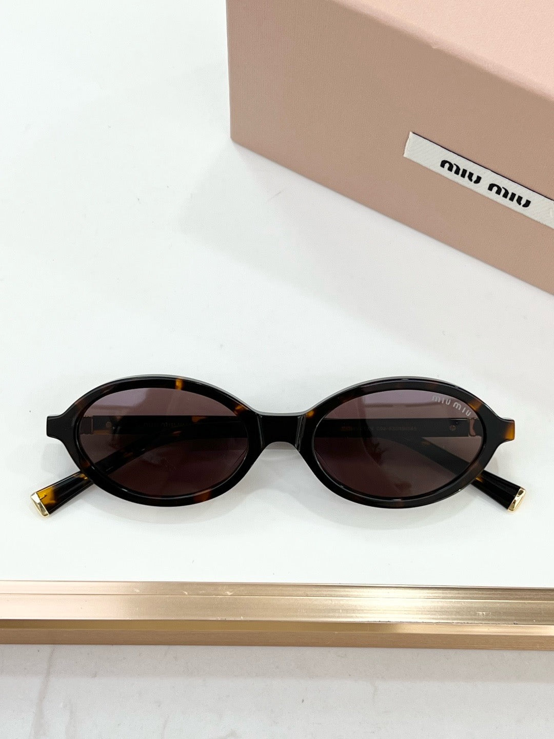 MIU MIU OMU 01XV