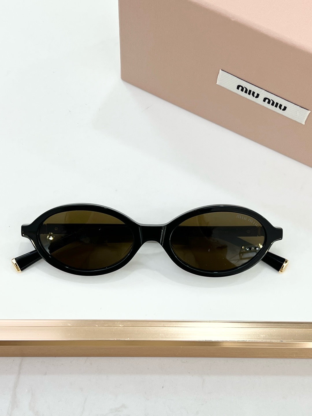 MIU MIU OMU 01XV