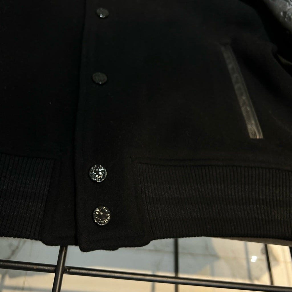 Blouson embossé monogram en cuir et laine