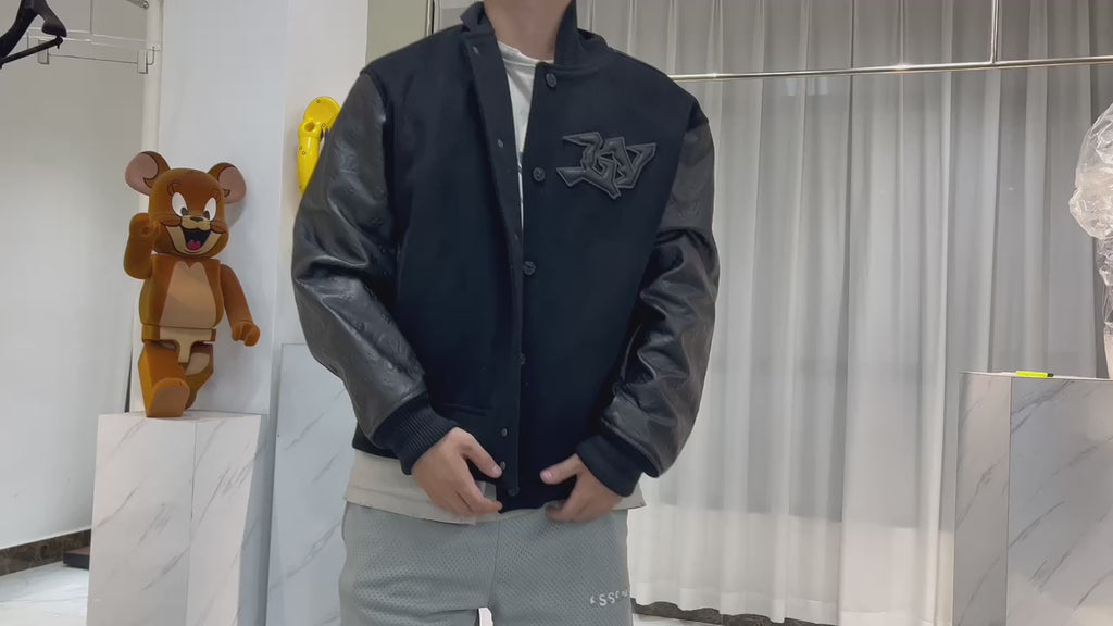 Blouson embossé monogram en cuir et laine